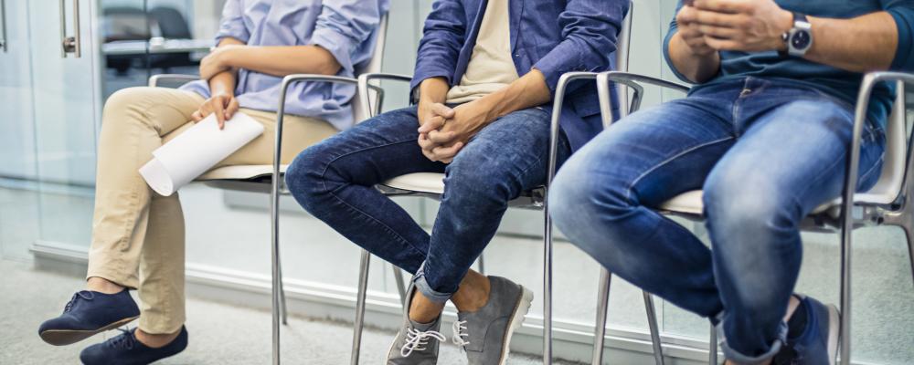 Students sitting in chairs waiting for their appointment