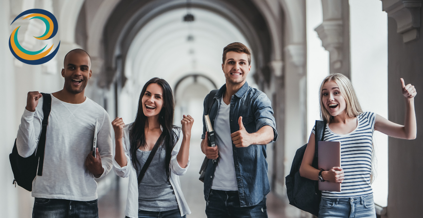 Group of four students on a post-secondary campus smiling. The EYES-ON-PSE logo is visible in the corner of the image. 