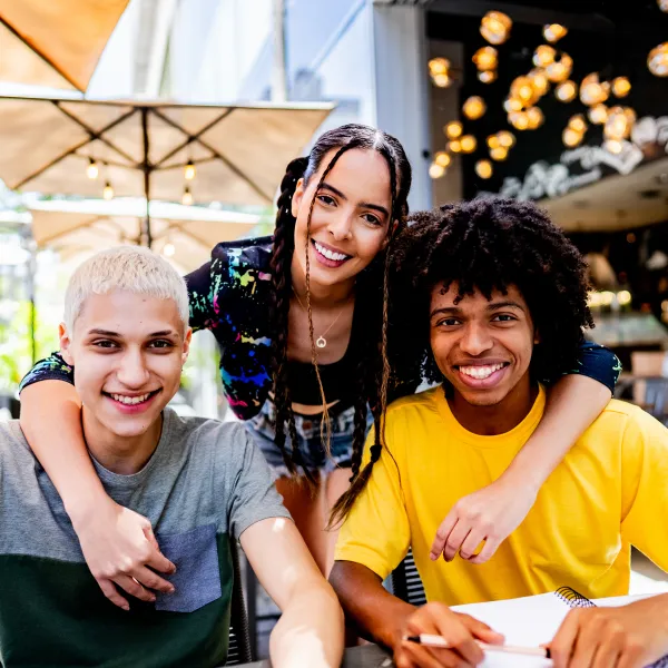 Portrait of a young friends studying at a coffee shop
